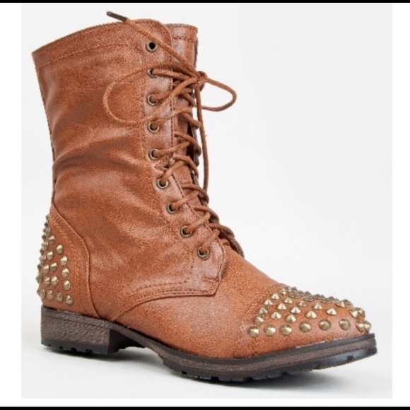 combat boots with gold accents